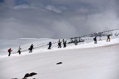 04E Snowboarders Walking Uphill View From The Chair Lift To Garabashi 3730m To Start The Mount Elbrus Climb.jpg